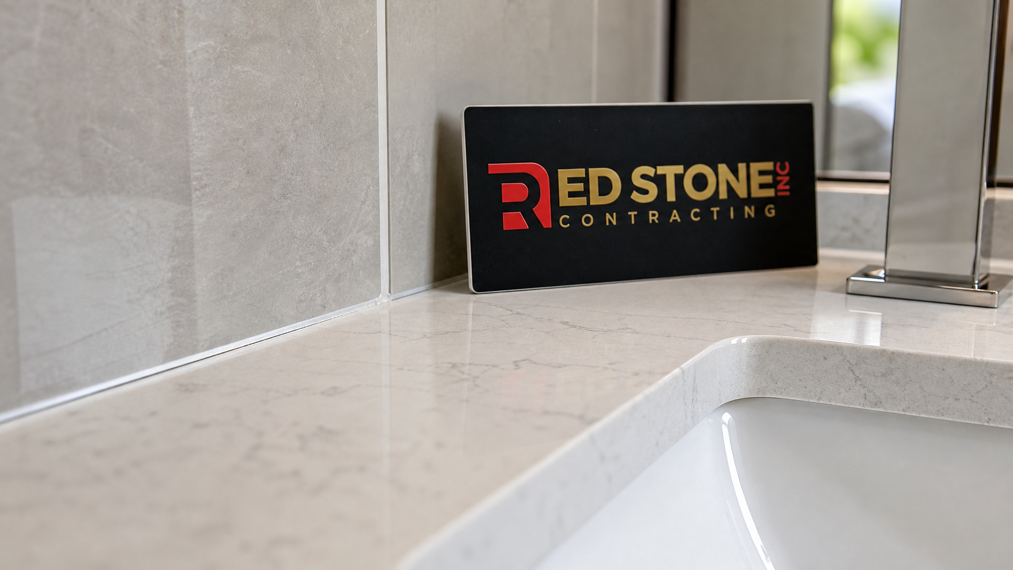 Close-up of large-format porcelain tile and quartz countertop detail in a Richmond Hill bathroom renovation