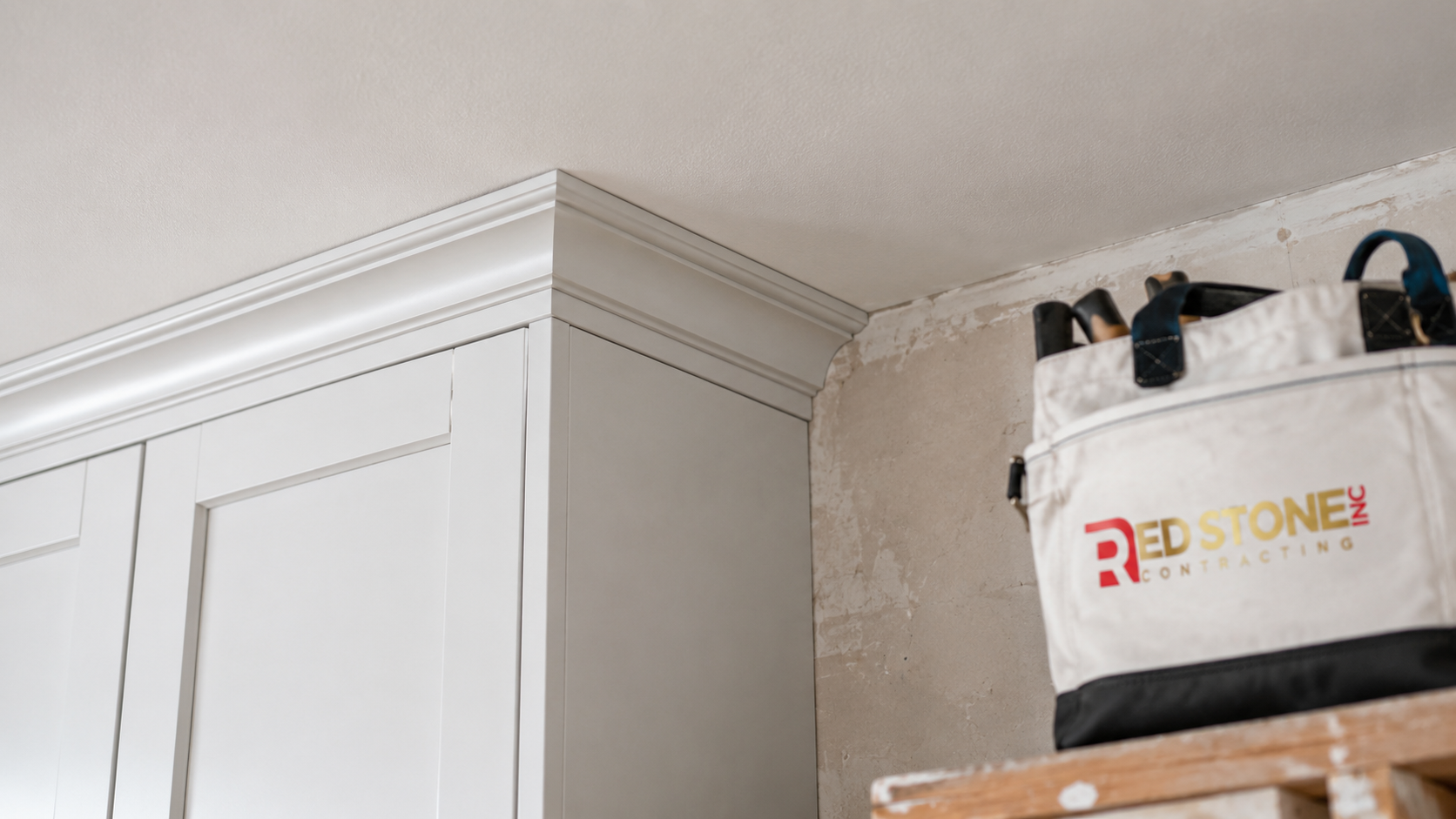 Detail of ceiling height cabinetry and trim in a completed kitchen renovation East York home