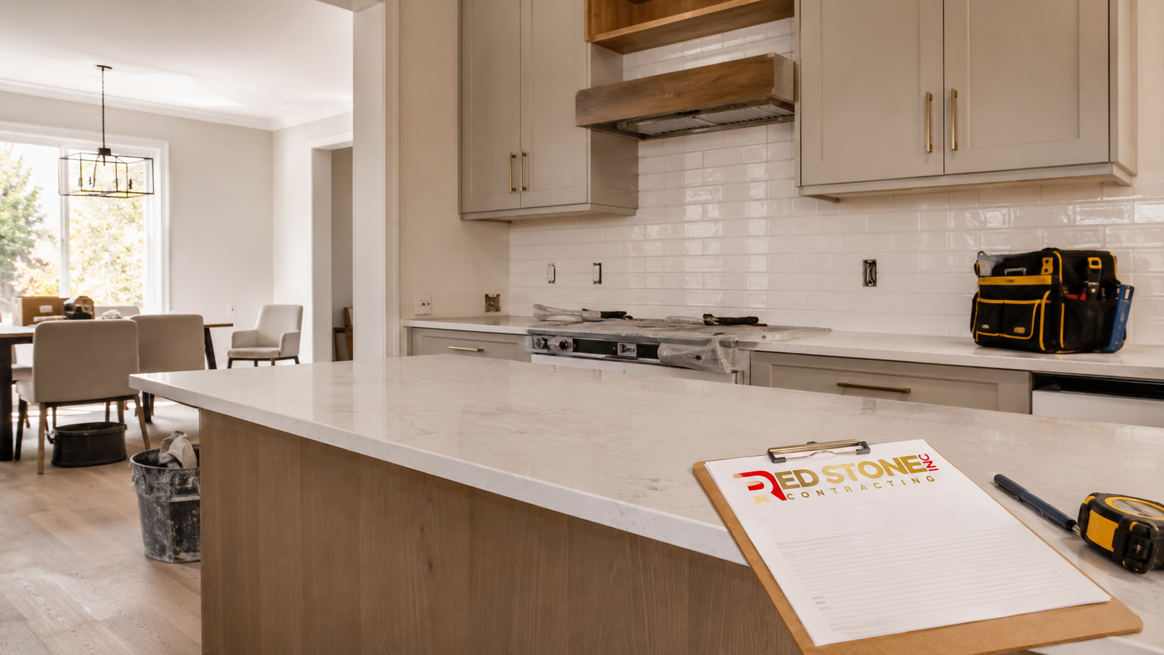 Bright open concept kitchen with island and new cabinetry showing a completed kitchen renovation Etobicoke result