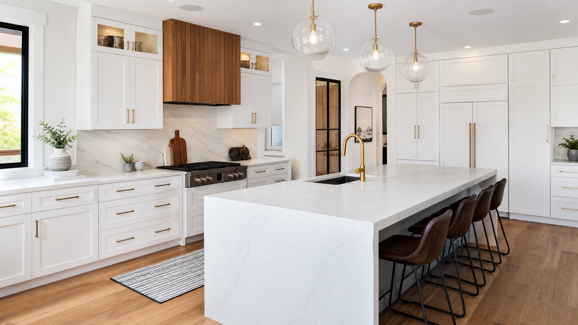 Completed luxury white shaker kitchen renovation with quartz waterfall island by Red Stone Contracting